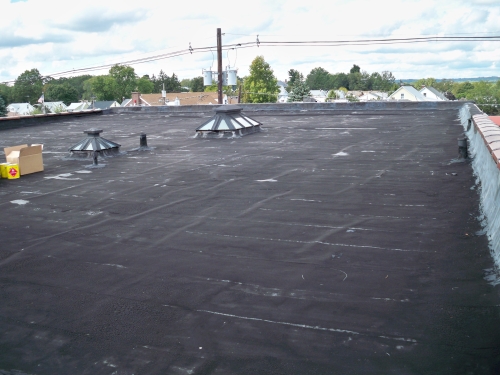 work being done on a commercial roof