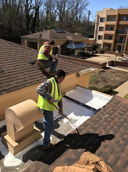 applying a silicone roof restoration system