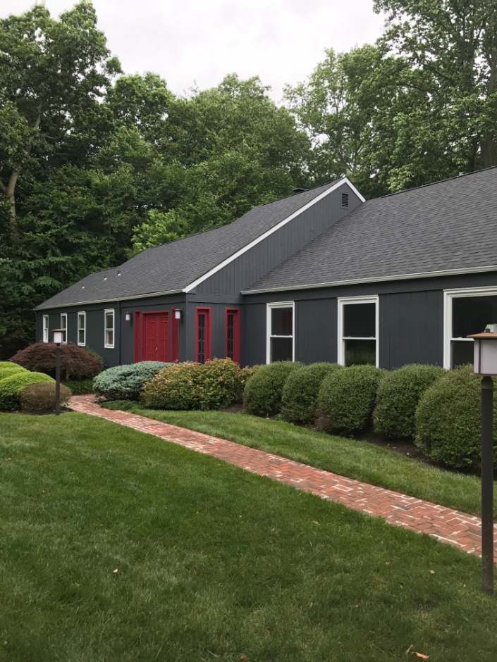 home with a sleek shingle roof