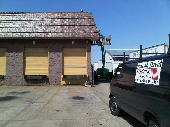 building with a metal shingle roof
