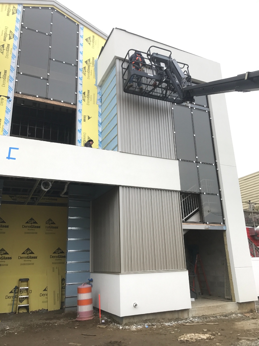 workers applying siding